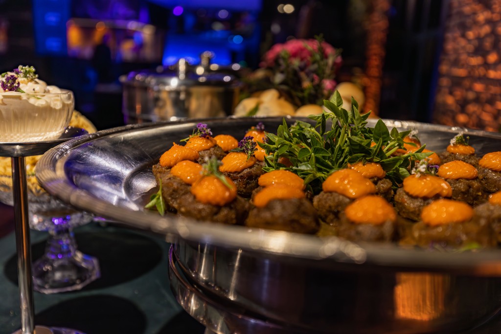 Gourmet appetizers served on a silver platter at an event